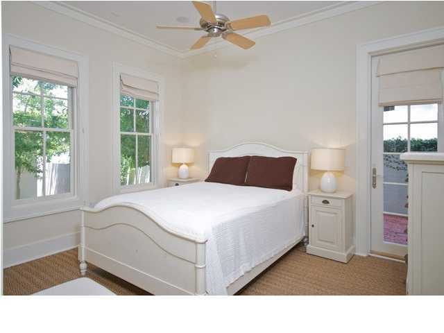 15 Atticus Road, Unit 15 Rosemary Beach, FL 32461 - Photo 22 of 26 a bedroom with a bed and a large window