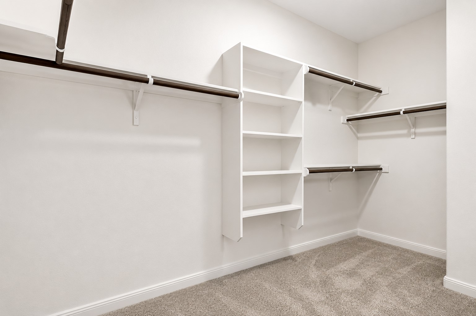 304 Santa Maria Street Georgetown, TX 78628 - Photo 19 of 37 Ample storage solutions abound in this well-appointed walk-in closet, ready to organize your wardrobe.