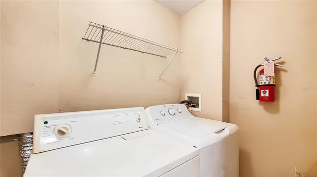 a utility room with dryer and washer
