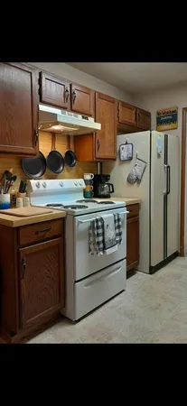 a kitchen with stainless steel appliances granite countertop a stove and a sink