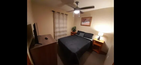 a room with wooden floor and furniture