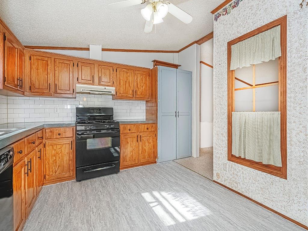 120 Dance Hall Road Apollo, PA 15613 - Photo 12 of 28 a kitchen with granite countertop a refrigerator and a stove top oven