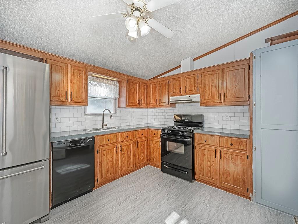 120 Dance Hall Road Apollo, PA 15613 - Photo 13 of 28 a kitchen with stainless steel appliances granite countertop a stove sink refrigerator and cabinets