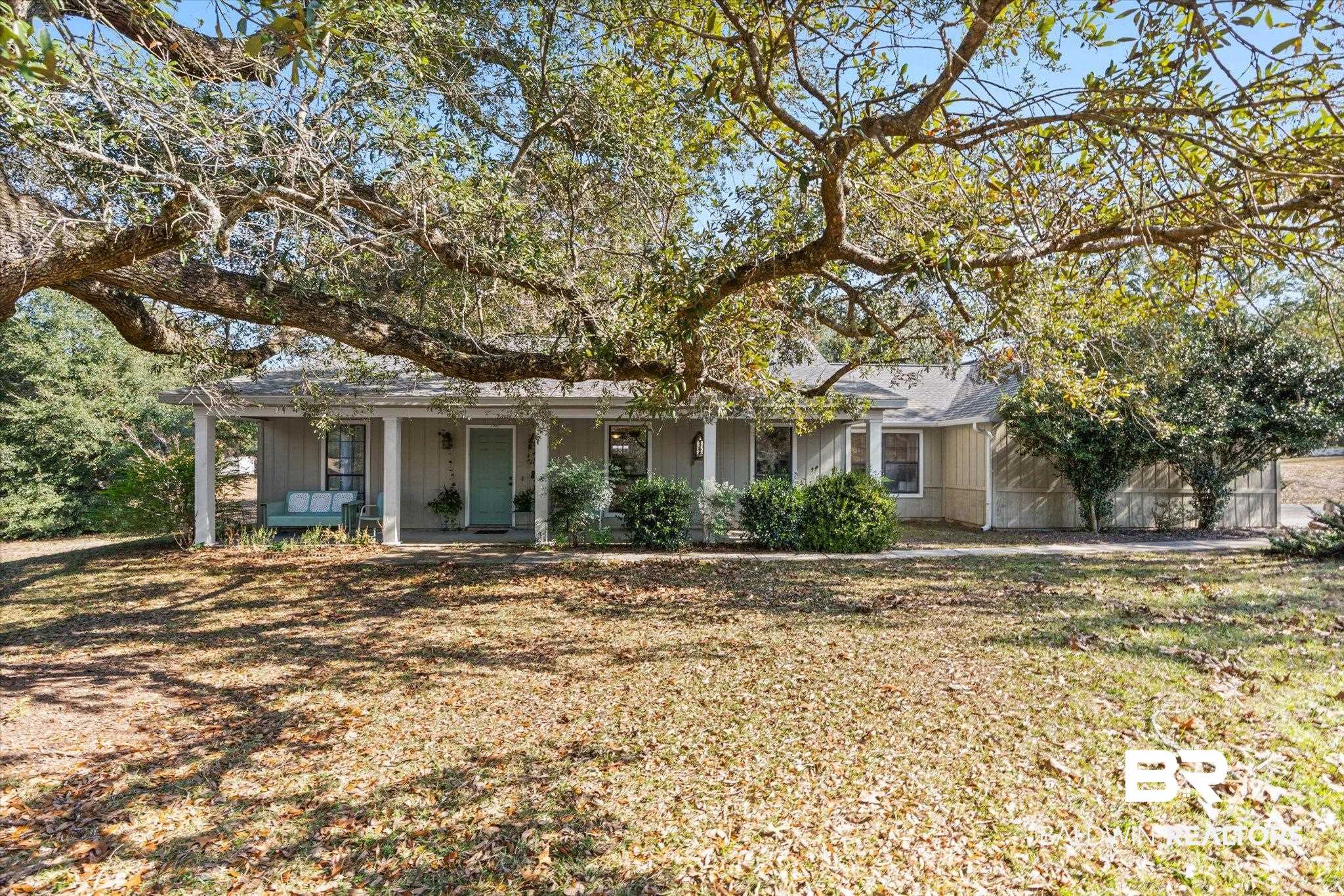 3846 Leslie Road Saraland, AL 36571 - Photo 1 of 40 View of front of property featuring a porch and a front lawn