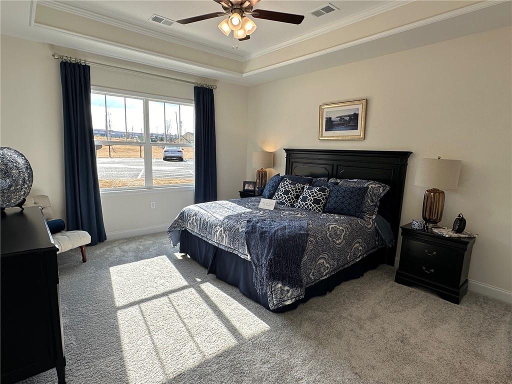 1702 Bonica Crossing, Unit 1702 Cumming, GA 30040 - Photo 7 of 18 a bedroom with a bed and window
