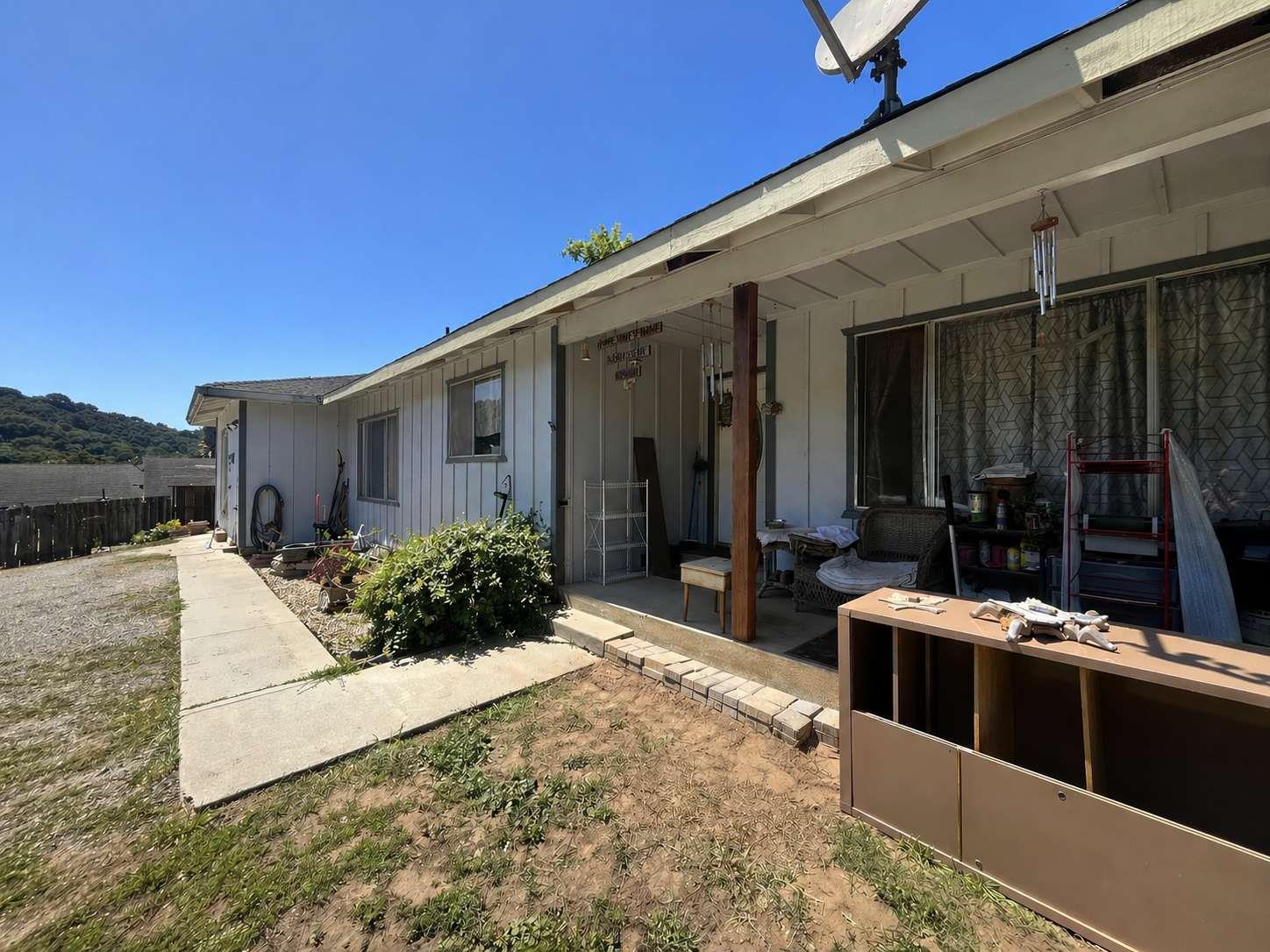 a view of house with outdoor seating