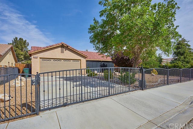 a view of a wrought iron fences in front of house
