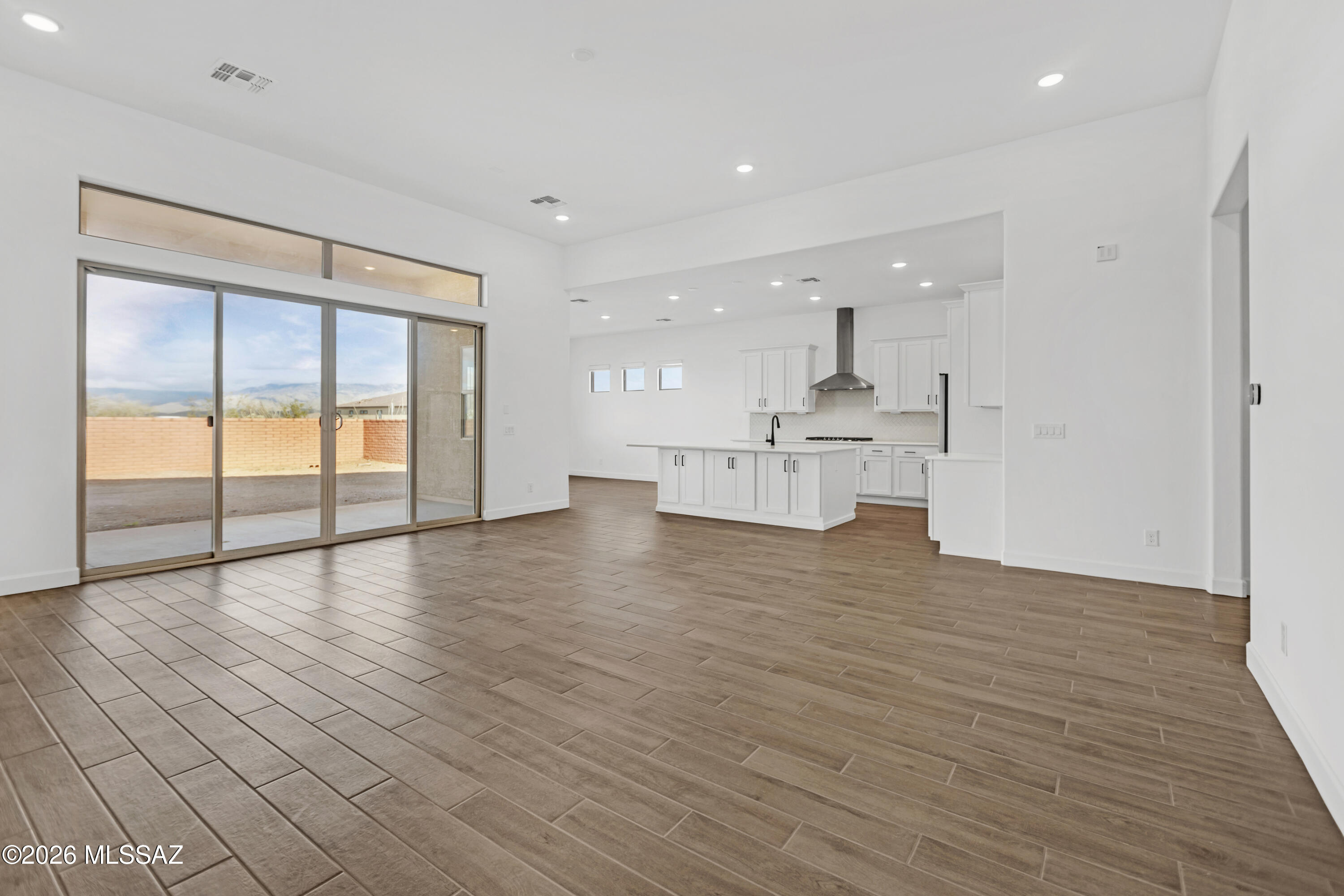 14736 East Sands Ranch Road Vail, AZ 85641 - Photo 2 of 20 a view of empty room with wooden floor and windows