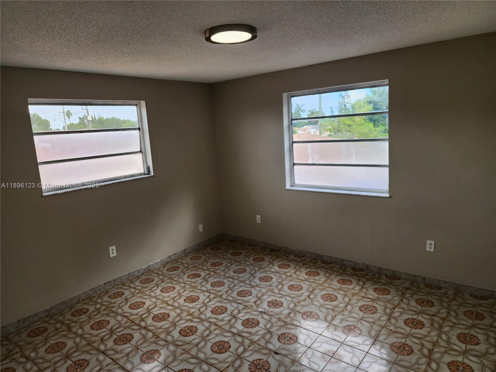 74 East 17th Street, Unit 70 Hialeah, FL 33010 - Photo 27 of 38 a view of an empty room with a window