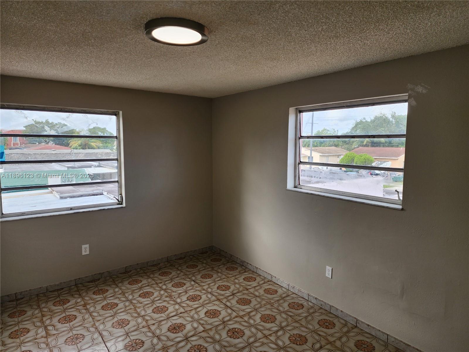 74 East 17th Street, Unit 70 Hialeah, FL 33010 - Photo 28 of 38 an empty room with a window