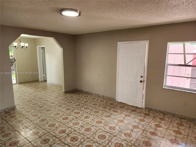 a view of an empty room and window