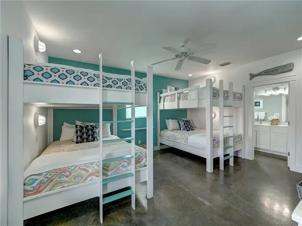 a bedroom with furniture and a large window