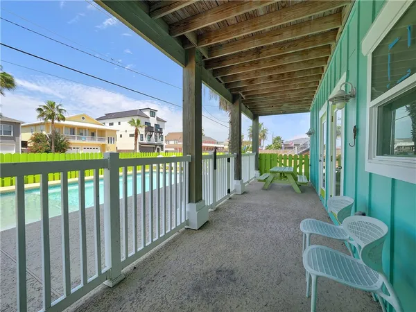 a view of a porch with furniture