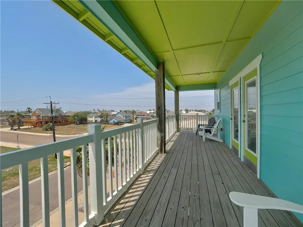 a view of a balcony with chairs