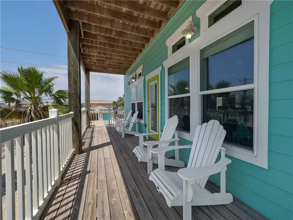 a view of balcony with furniture