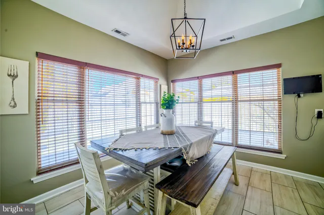 a view of a dining room with furniture window and outside view