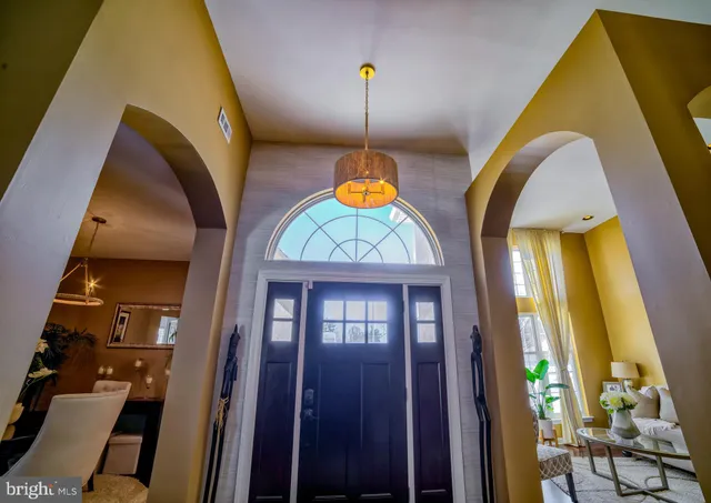 a front view of a residential houses with yard