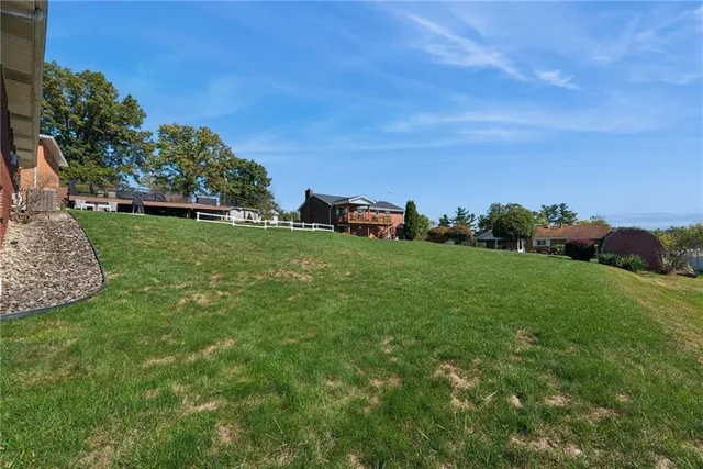 a view of a field with an trees