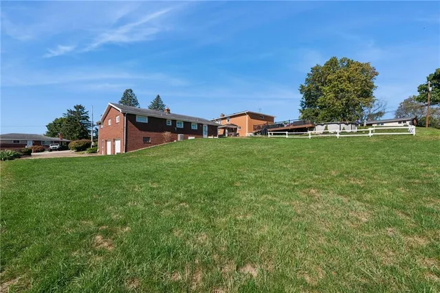 a backyard of a house with lots of green space