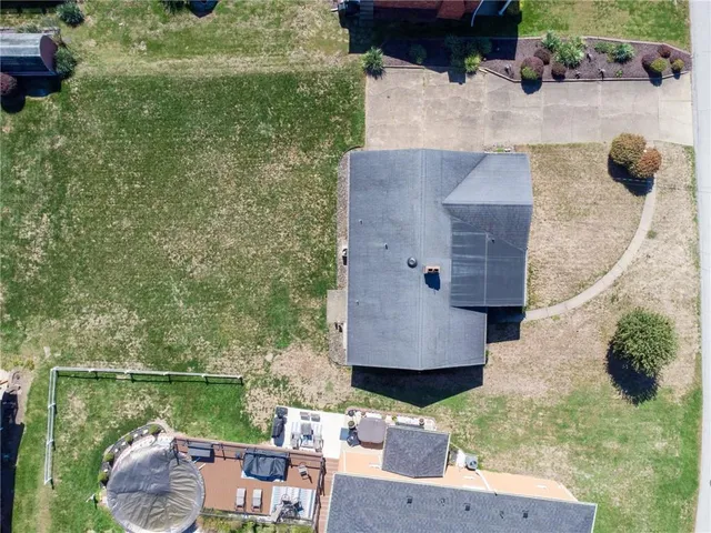an aerial view of a house with outdoor space