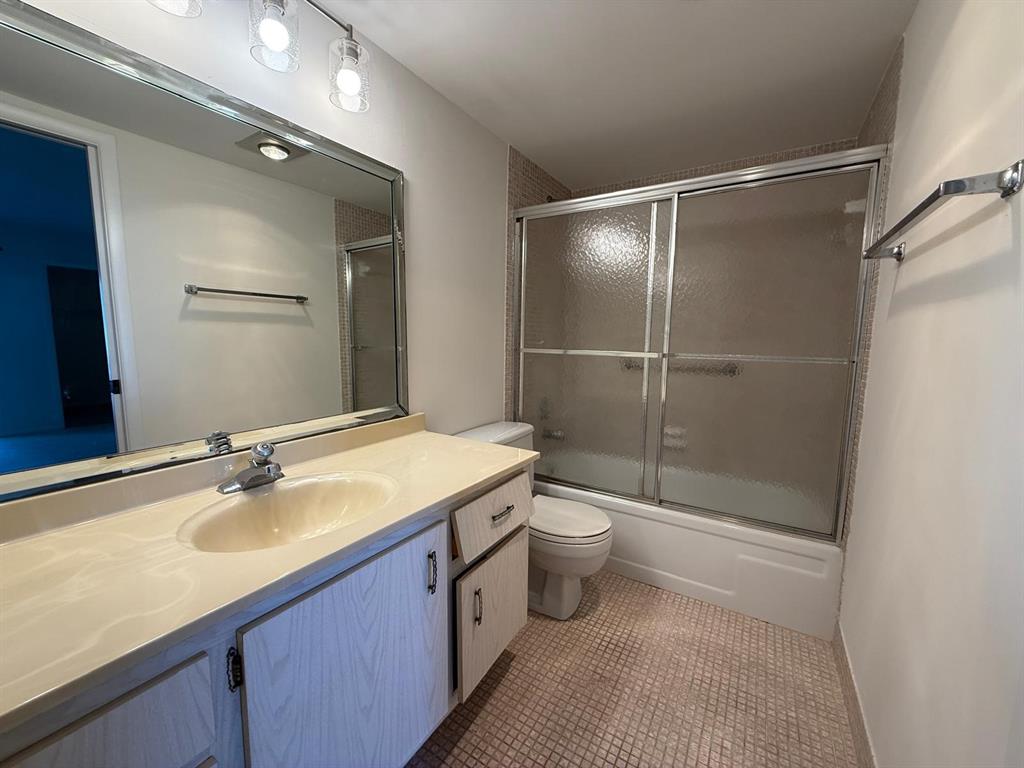 3022 Ainslie Drive, Unit 3022 Boca Raton, FL 33434 - Photo 17 of 29 a bathroom with a sink toilet and shower