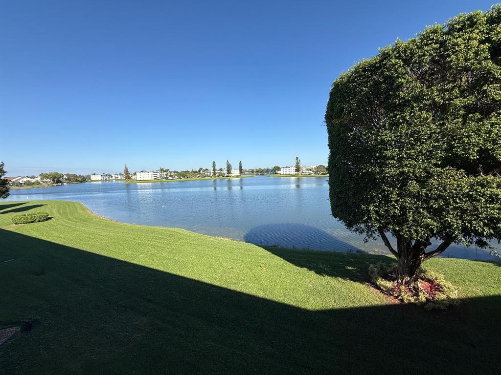 3022 Ainslie Drive, Unit 3022 Boca Raton, FL 33434 - Photo 19 of 29 a view of a lake with outdoor space and a lake view