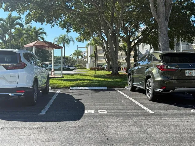 a view of a storage & utility room with a refrigerator
