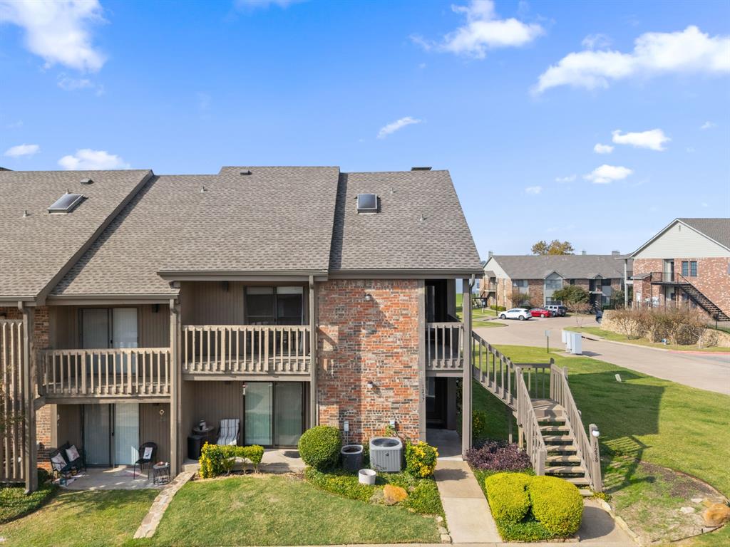 1238 Signal Ridge Place Rockwall, TX 75032 - Photo 5 of 32 an aerial view of a house with swimming pool and furniture