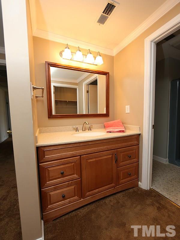 412 Southeast Maynard Road Cary, NC 27511 - Photo 12 of 19 New Back-Saver height vanity along with high efficiency, chair-height, dual flush toilet.