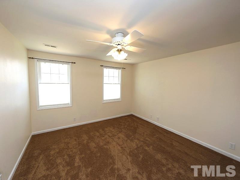 412 Southeast Maynard Road Cary, NC 27511 - Photo 14 of 19 3 secondary Bedrooms. Two have Walk-In Closets and this particular Bedroom has a wall of Closet space.