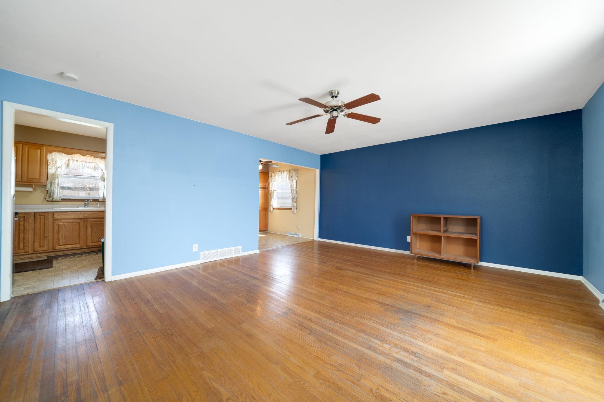 1611 Notre Dame Road Rockford, IL 61103 - Photo 2 of 33 a view of empty room with wooden floor and fan
