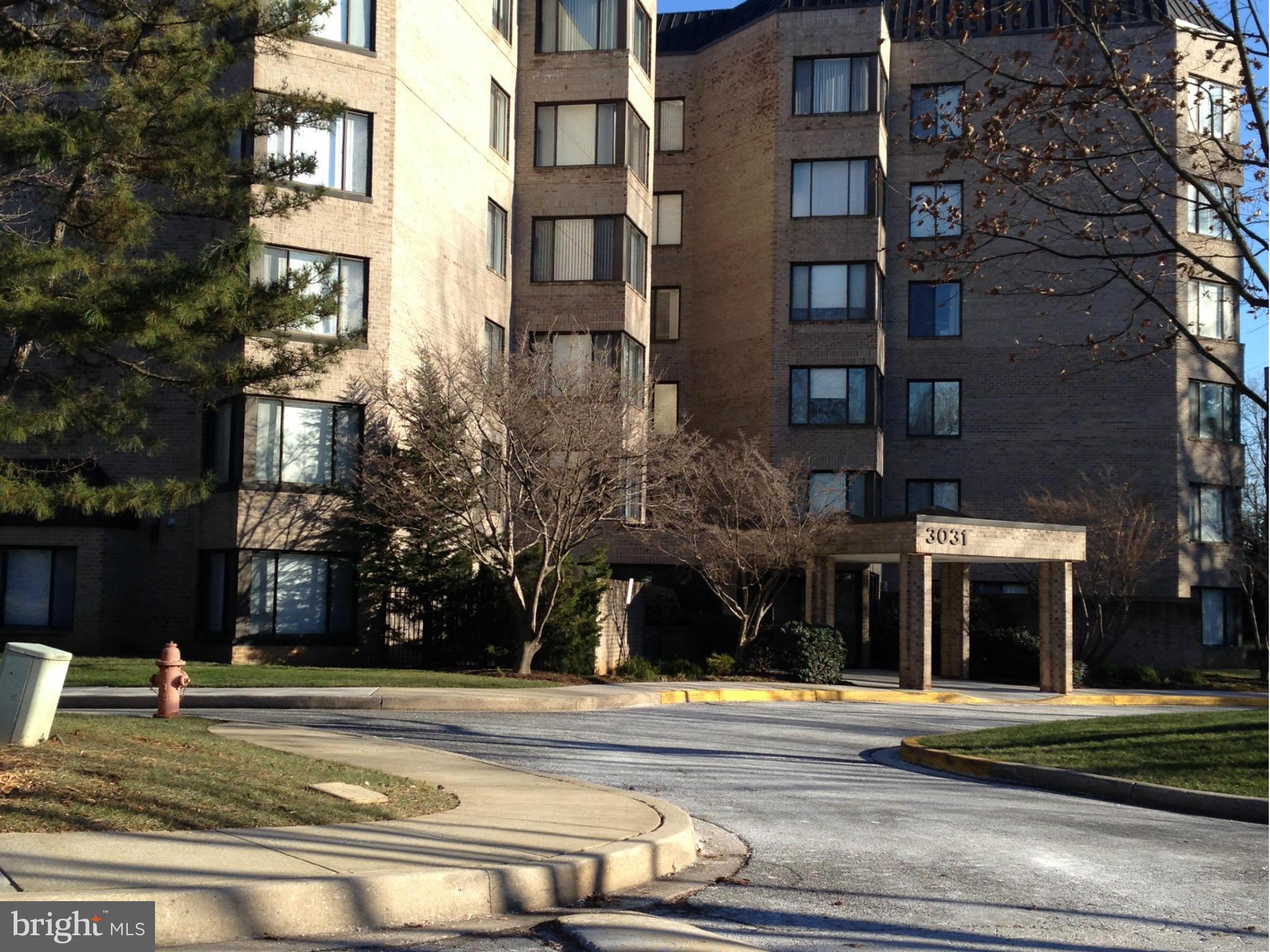 3031 Fallstaff Road, Unit 602C Baltimore, MD 21209 - Photo 1 of 13 a view of a building and a yard