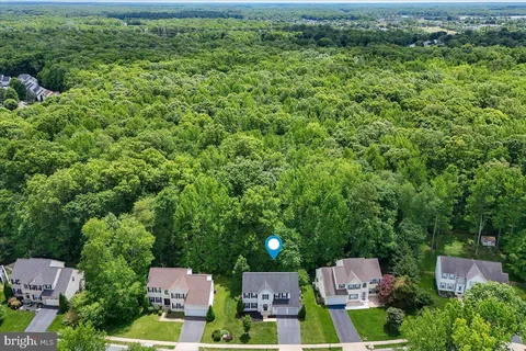 an aerial view of residential house with outdoor space