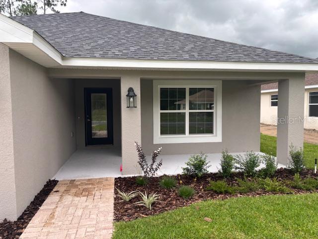 7637 Southwest 180th Circle Dunnellon, FL 34432 - Photo 4 of 23 a front view of a house