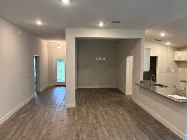 7637 Southwest 180th Circle Dunnellon, FL 34432 - Photo 5 of 23 a view of a kitchen with a sink and a refrigerator