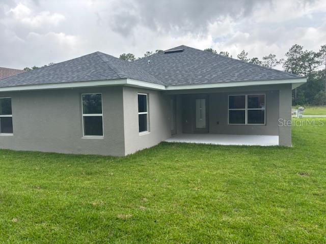 7637 Southwest 180th Circle Dunnellon, FL 34432 - Photo 10 of 23 a view of a house with a yard