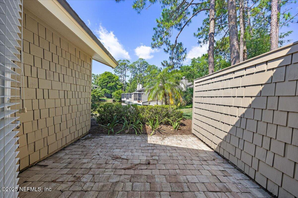 80 Fishermans Cove Road Ponte Vedra Beach, FL 32082 - Photo 19 of 22 Paver patio off 3rd bedroom
