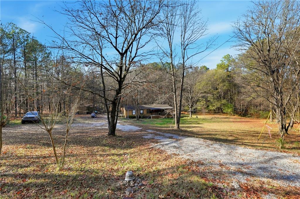 92 Vaughn Spur Northeast Cartersville, GA 30121 - Photo 14 of 50 a view of yard with tree in the background