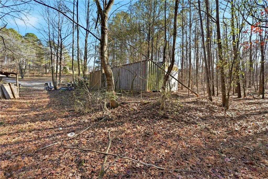 92 Vaughn Spur Northeast Cartersville, GA 30121 - Photo 20 of 50 a backyard of a house with lots of green space