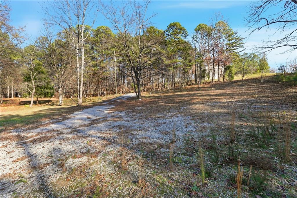 92 Vaughn Spur Northeast Cartersville, GA 30121 - Photo 21 of 50 a view of road with trees