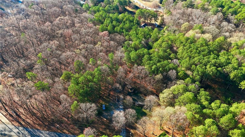 92 Vaughn Spur Northeast Cartersville, GA 30121 - Photo 27 of 50 a backyard of a house with lots of plants