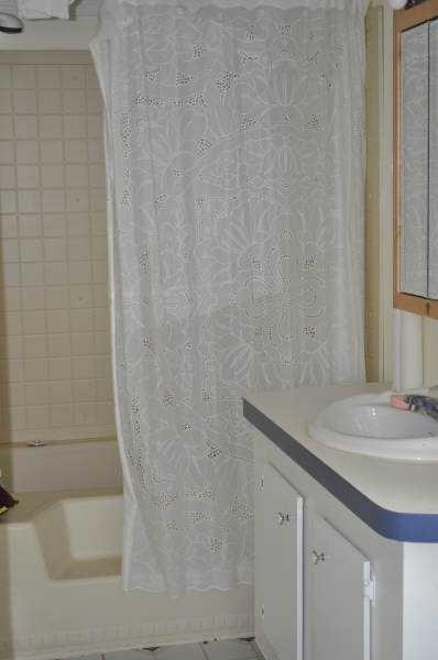 92 Vaughn Spur Northeast Cartersville, GA 30121 - Photo 29 of 50 a bathroom with a granite countertop sink and a bathtub