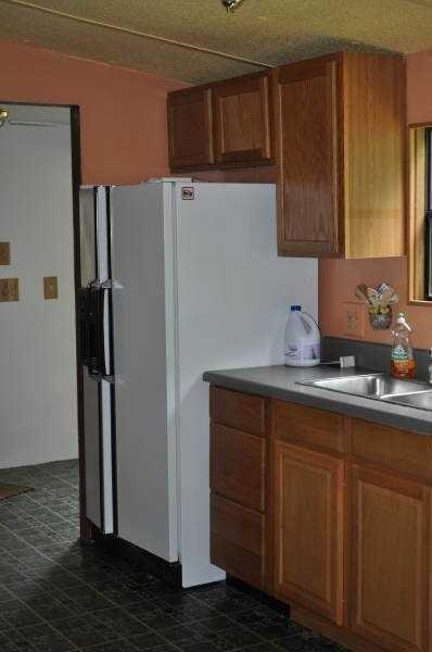 92 Vaughn Spur Northeast Cartersville, GA 30121 - Photo 32 of 50 a kitchen with stainless steel appliances granite countertop a refrigerator and a sink
