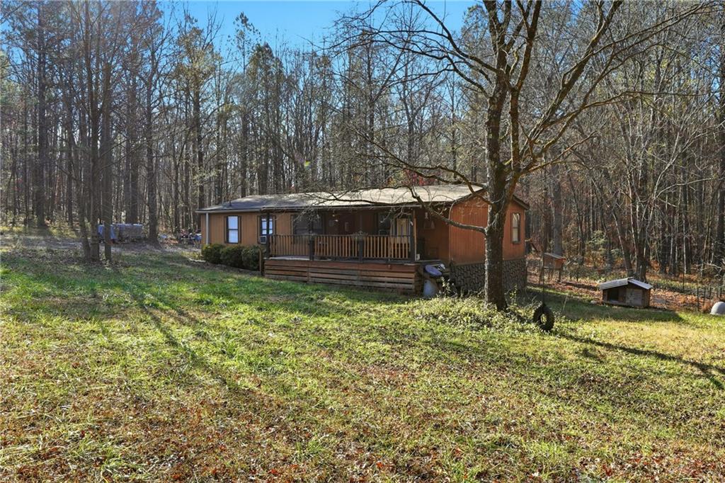 92 Vaughn Spur Northeast Cartersville, GA 30121 - Photo 4 of 50 a backyard of a house with yard table and chairs