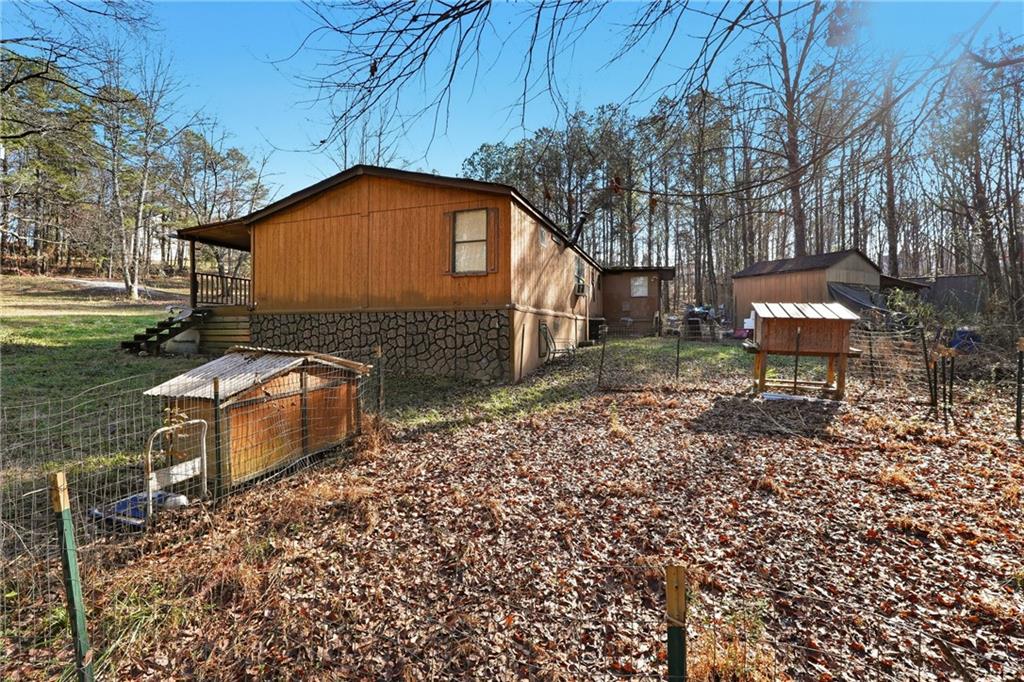 92 Vaughn Spur Northeast Cartersville, GA 30121 - Photo 7 of 50 a backyard of a house with table and chairs