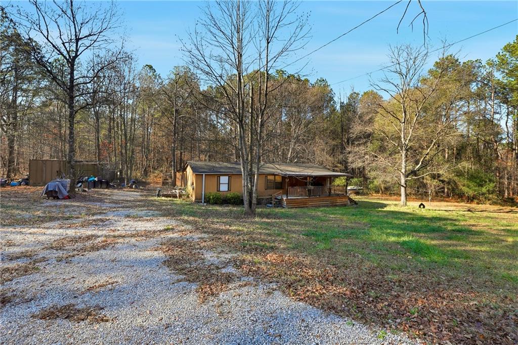 92 Vaughn Spur Northeast Cartersville, GA 30121 - Photo 10 of 50 a view of a house with a yard