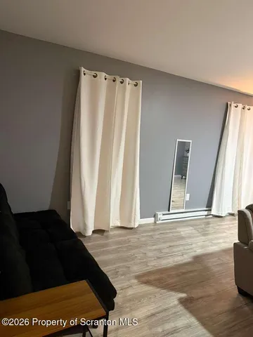 a view of entry way with wooden door