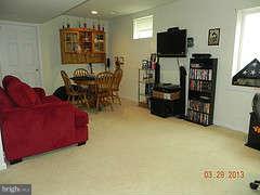 671 Hunters Road Culpeper, VA 22701 - Photo 22 of 27 a living room with furniture and a flat screen tv