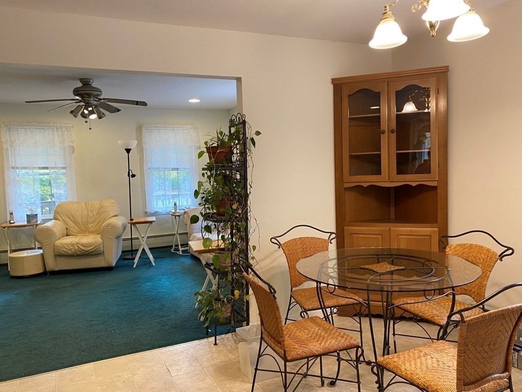 73 Cummings Road Ware, MA 01082 - Photo 10 of 29 a living room with furniture and a potted plant