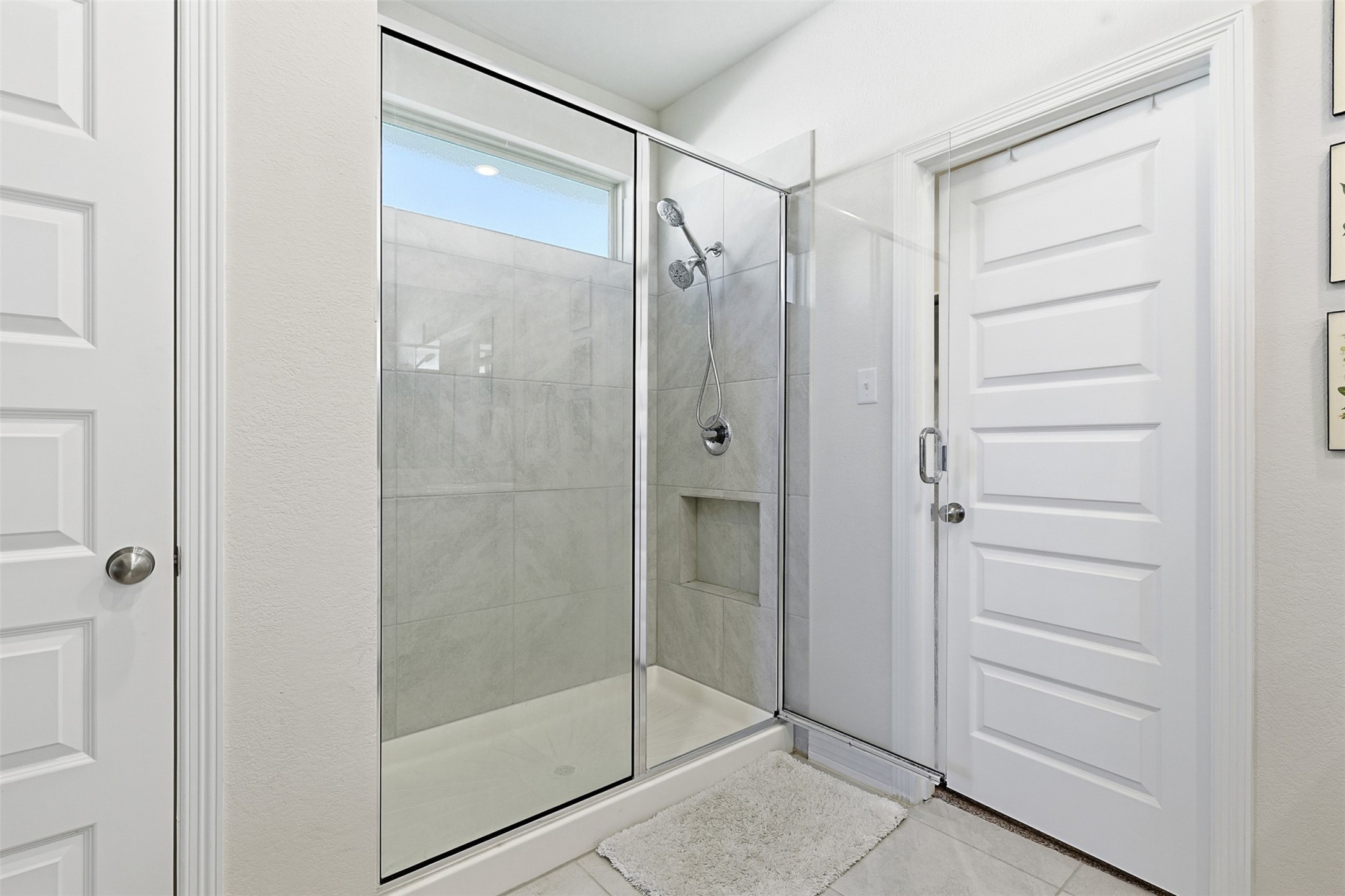 2773 Bluebonnet Ridge Drive Conroe, TX 77304 - Photo 10 of 23 a bathroom with a glass shower door